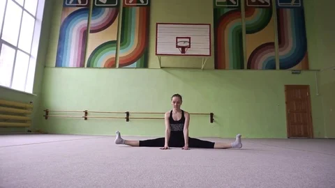 Gymnast doing warm-up. Workout in the gym. Stock Footage 77580592