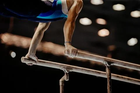 Gymnast exercise parallel bars Stock Photos