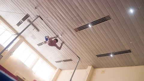 Gymnast exercises high horizontal bar HD slow-motion video. Athlete gymnastics Stock Footage 74728479