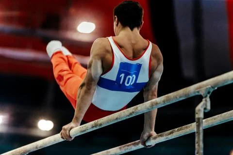 Gymnast exercises on parallel bars 写真素材