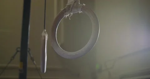 Gymnast jumps up and grabs rings 스톡 동영상 132286053