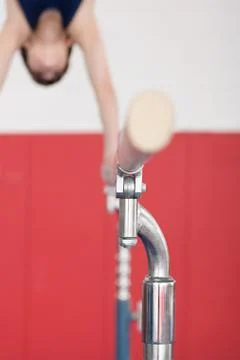 Gymnast on parallel bars Stock Photos