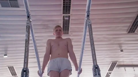 Gymnast performs routine on parallel bars HD gymnastics slow-motion video Stock-Footage 73123675