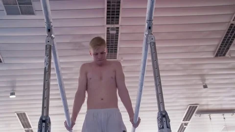 Gymnast performs routine on parallel bars HD gymnastics slow-motion video Stock Footage 73123682