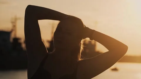 Gymnast Performs Tricks on the Beach Stock Footage 139435132