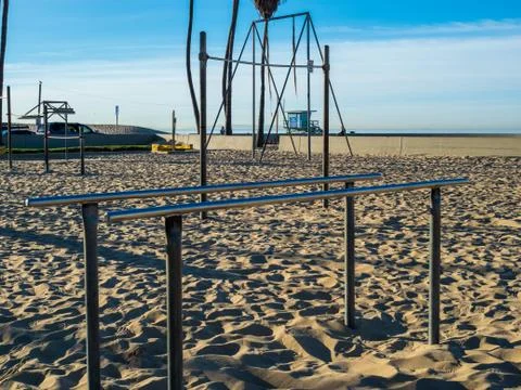 Gymnastics and exercise parallel bars on beach in outdoor gym Stock Photos