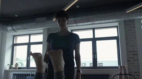 Gymnastics instructor monitors the exercise and says something Stock-Footage 102546361