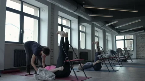 Gymnastics instructor shows the student how to do the exercise correctly Stock Footage 102546326