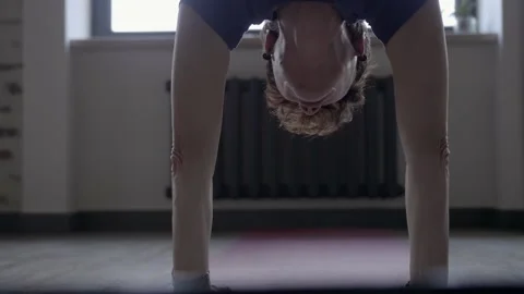 Gymnastics teacher does the exercise and says something Video stock 102547394