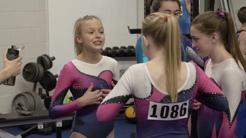 Gymnasts talking and laughing backstage | Stock Video | Pond5