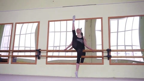 Gymnasts warming up at the mirror. Workout in the gym. Stock Footage 77522836