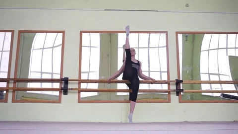 Gymnasts warming up at the mirror. Workout in the gym. Stock Footage 77609918