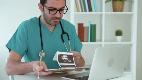 Gynecologist talking to client using virtual chat showing medical reports Stock Footage 168503908