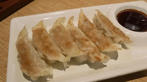 Gyoza a Japanese dumpling set on table. Stock Footage 312801422