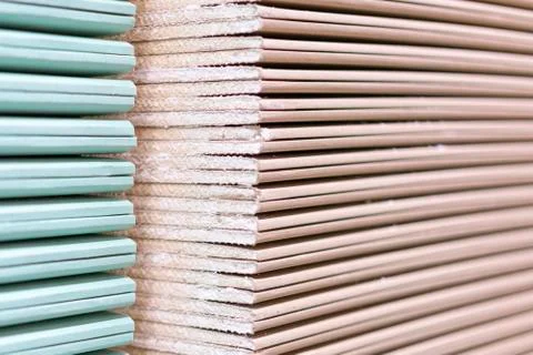 Gypsum plasterboard in the pack. The stack of gypsum board preparing for cons Stock Photos
