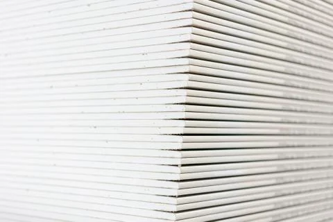 Gypsum plasterboard in the pack. The stack of gypsum board preparing for cons Stock Photos