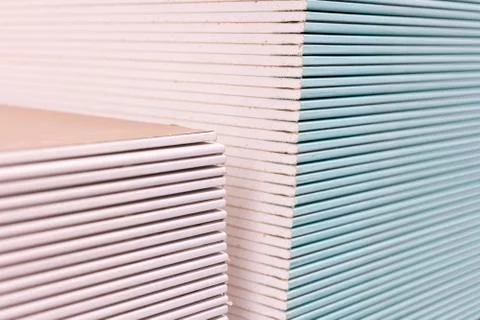 Gypsum plasterboard in the pack. The stack of gypsum board preparing for cons Stock Photos