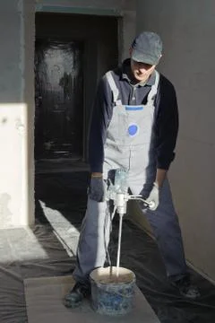 Gypsum puttying manually. Stock Photos