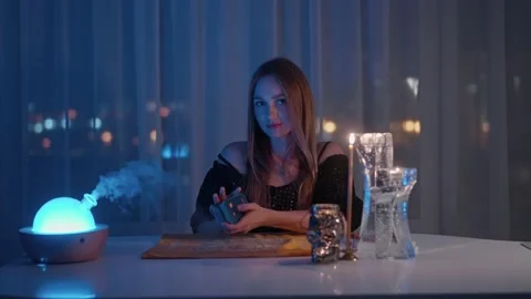 Gypsy fortune teller shuffling occult tarot cards. Magical pagan destiny reading Stock Footage 161908104