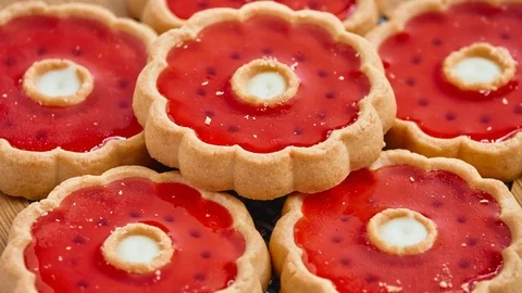 Gyration Round delicious shortbread in the form of a flower with red jelly on Stock Footage 116806838