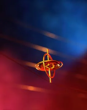 A gyroscope, a top, balanced, spinning on a string, with copy space Stock Photos
