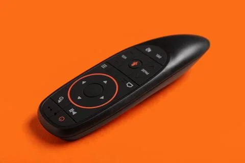Gyroscopic remote controller on orange background 库存照片