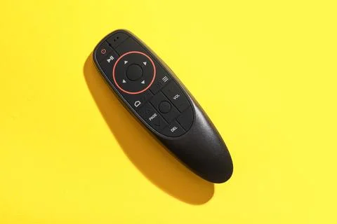 Gyroscopic remote controller on yellow background 库存照片