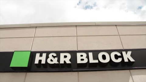 H and r block logo on front entrance of small store, shot from low angle Stock Footage 247142643