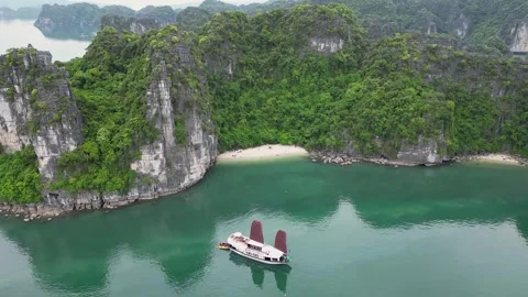 Ha Long Bay limestone cliffs and boat Stock Footage 300038410