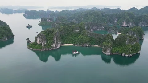 Ha Long Bay limestone cliffs and boat Stock Footage 300038439