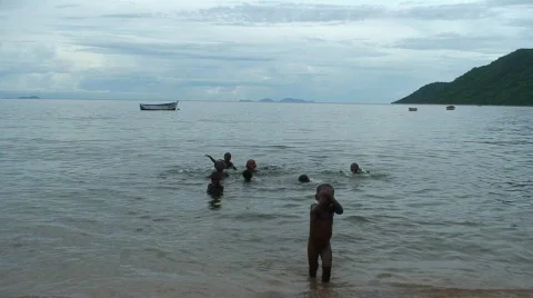 Ha0121 african children on a lake Stock Footage 362653