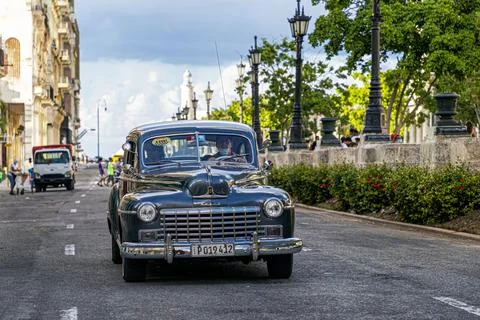 HABANA, CUBA - Oct 03, 2021: A vintage American car from the 50s driving thro Stock Photos