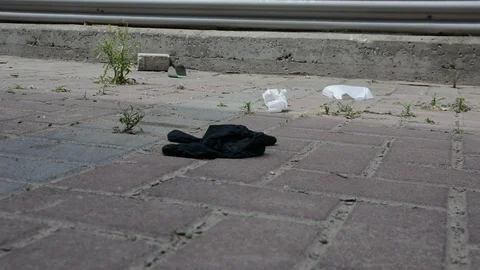Habitat pollution problem. Used gloves at the parking near supermarket.  Video stock 128603866