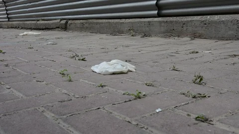 Habitat pollution problem. Used gloves at the parking near supermarket.  Video stock 128603908