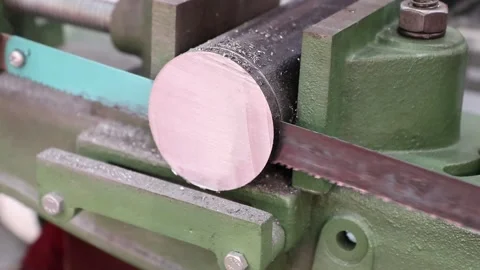 Hack saw machine cutting steel bar Stock Footage 130296688