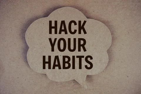 Hack Your Habits text with speech bubble on paper craft background Stock Photos