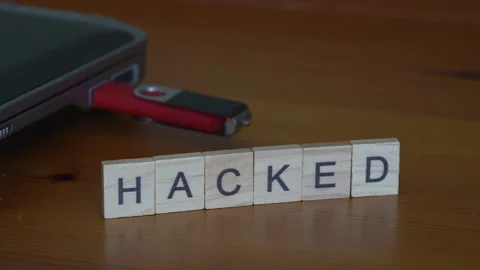 Hacked Concept With Hand Placing Final Letter D In Hacked Word Beside Usb Drive Stock Footage 343578760