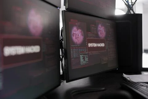Hacked system alert message showing on multiple monitors 写真素材