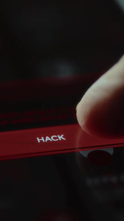 Hacker about to tap the red HACK button to compromise a digital device or Stock Footage 327899963