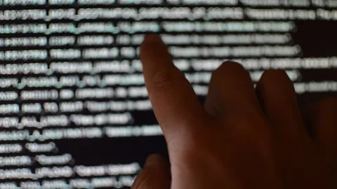 Hacker analyzing code program for software Stock Footage 199020516