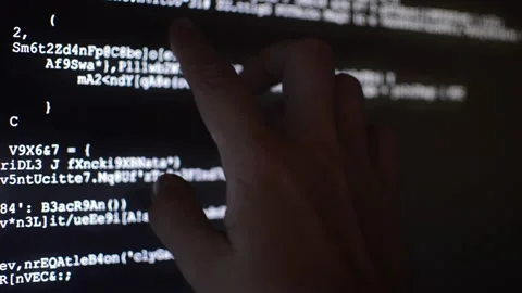 Hacker analyzing code program for software Stock Footage 199020535