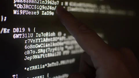 Hacker analyzing code program for software Stock Footage 199020536