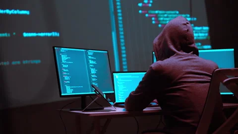 Hacker Analyzing Multiple Monitors Displaying Programming Code in a Digital.. 動画素材 336678574