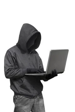 Hacker with anonymous mask with laptop while standing Stock-Fotos