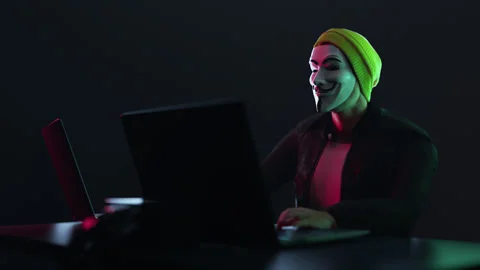 Hacker with anonymous mask work write the code 库存影片 149927990