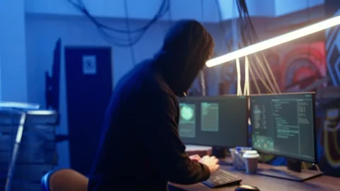 Hacker arriving in underground base, ready to do computer sabotage Stock Footage 319526639