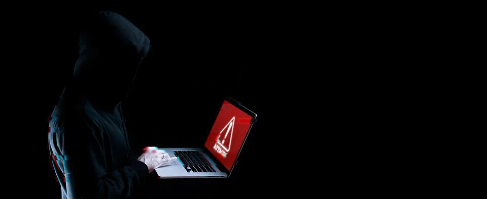 Hacker attack cyber security. Digital laptop in hacker man hand isolated on b Stock Photos