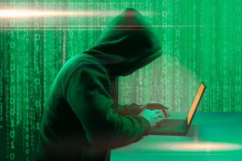 Hacker attack. Faceless hooded anonymous computer hacker. hooded hacker sitti Foto stock