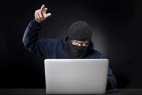 Hacker in a balaclava Stock Photos