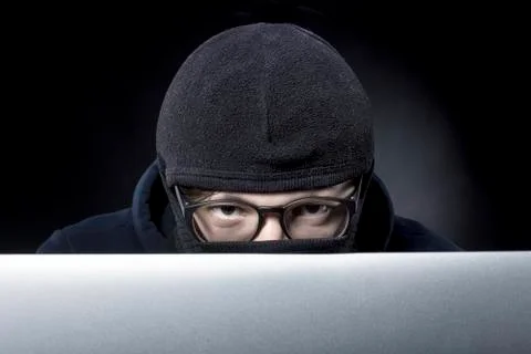 Hacker in balaclava Stock Photos